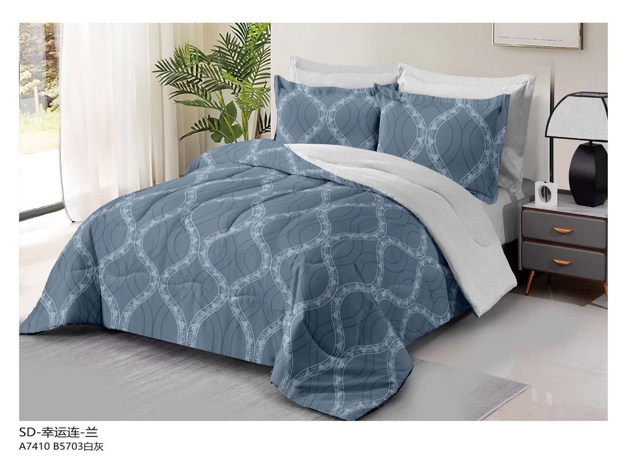 Reversible 3-piece printed quilt set with pillow covers – lightweight, soft, and beautifully designed for year-round comfort.